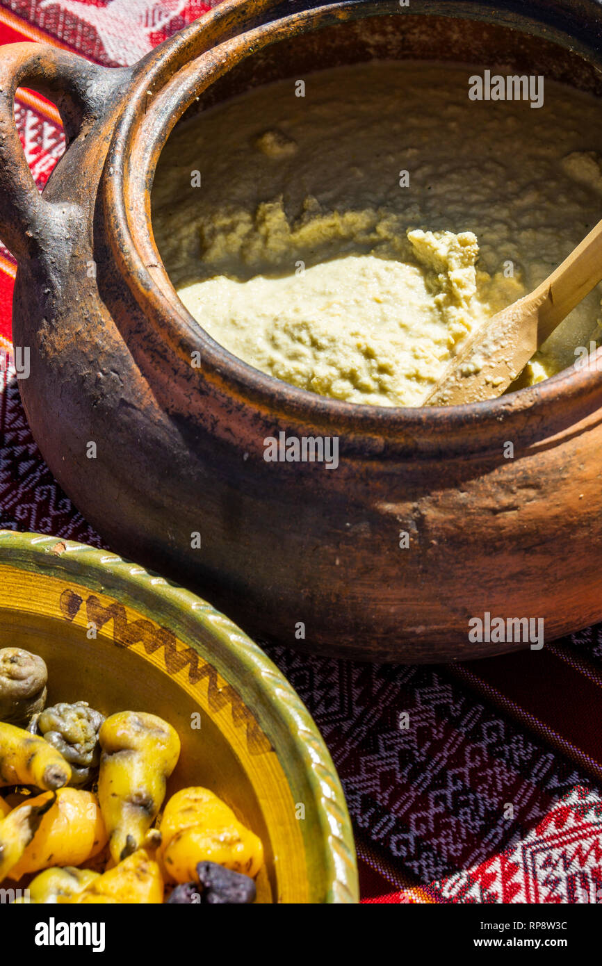 Incan traditional recipe potato dish in clay pot. Stock Photo