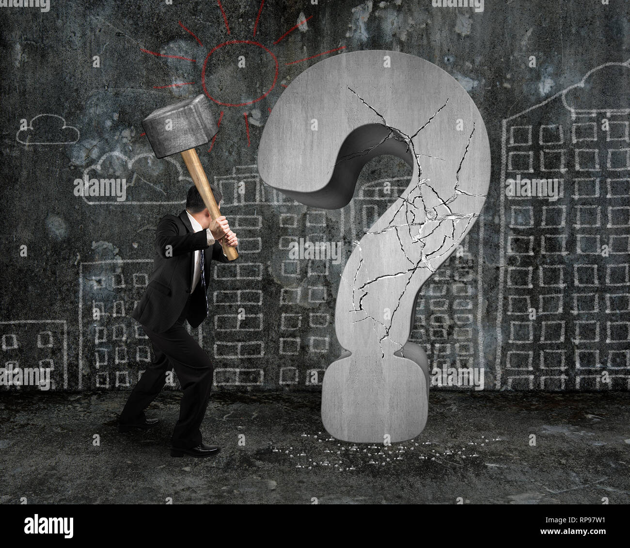 businessman holding hammer cracked question mark with city buildings
