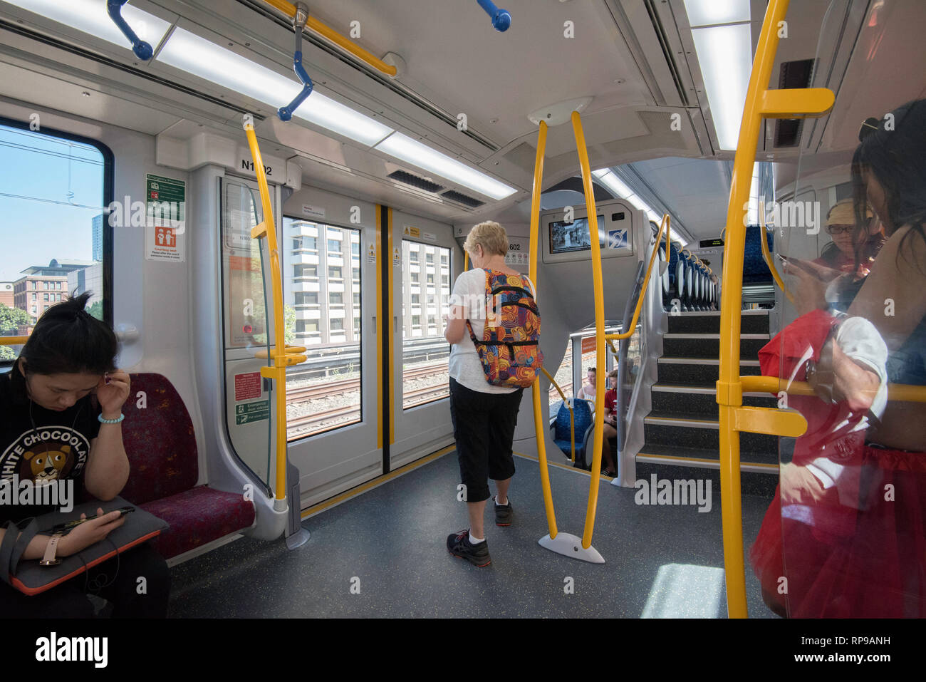 The interior vestibule or entrance area of a modern Waratah A Series train travelling on Sydney's North Shore T1 Line in New South Wales, Australia Stock Photo