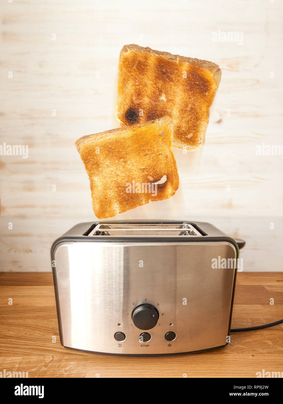 Jumping toasts. Preparing breakfast in modern toaster Stock Photo Alamy