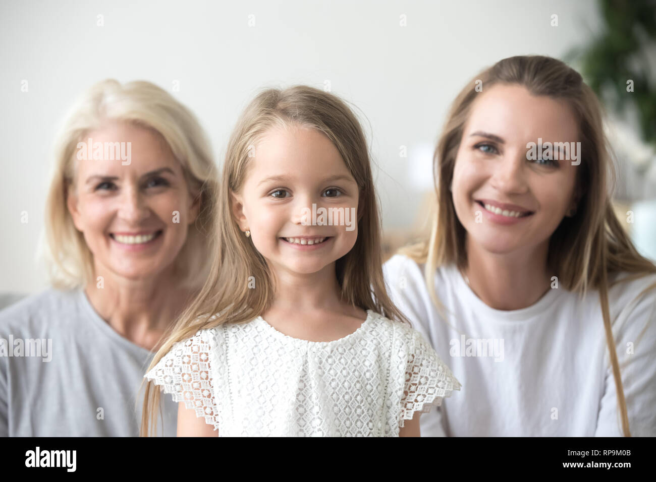 Head shot portrait grandmother, mother and daughter, three generations Stock Photo