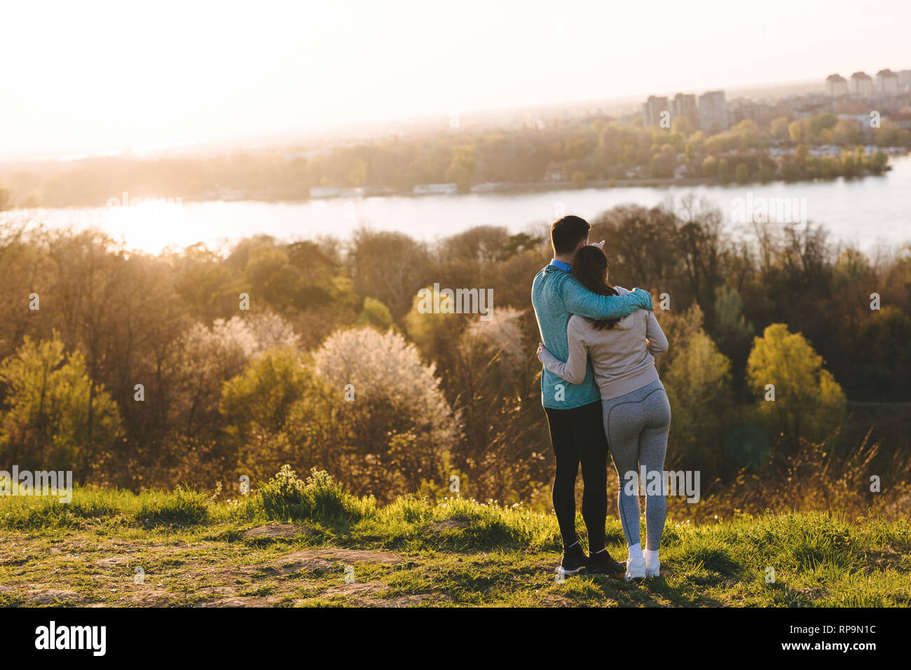 Happy young sporty couple sharing romantic moments Stock Photo - Alamy