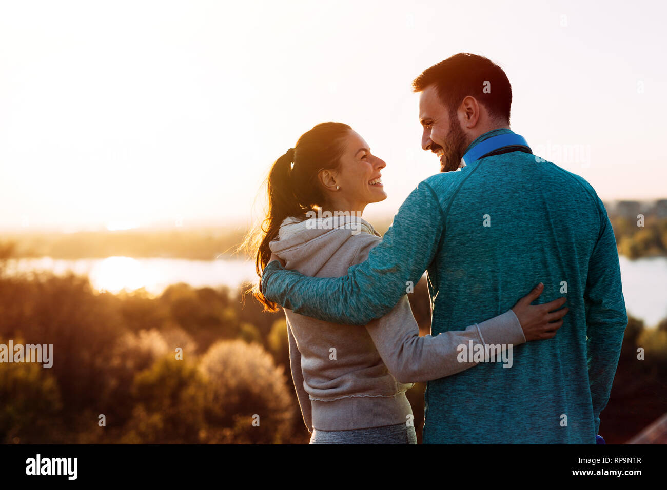 Happy young sporty couple sharing romantic moments Stock Photo - Alamy