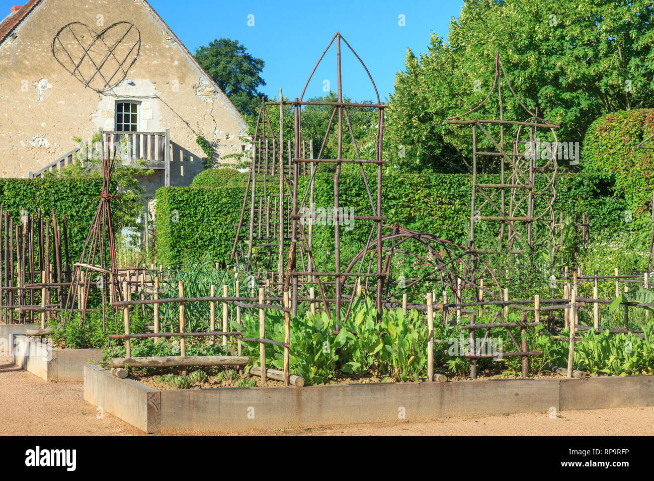 Orsan priory garden, France : the Simples Garden, medicinal herb garden with sweet chestnut tree structures (obligatory mention of the garden name and Stock Photo