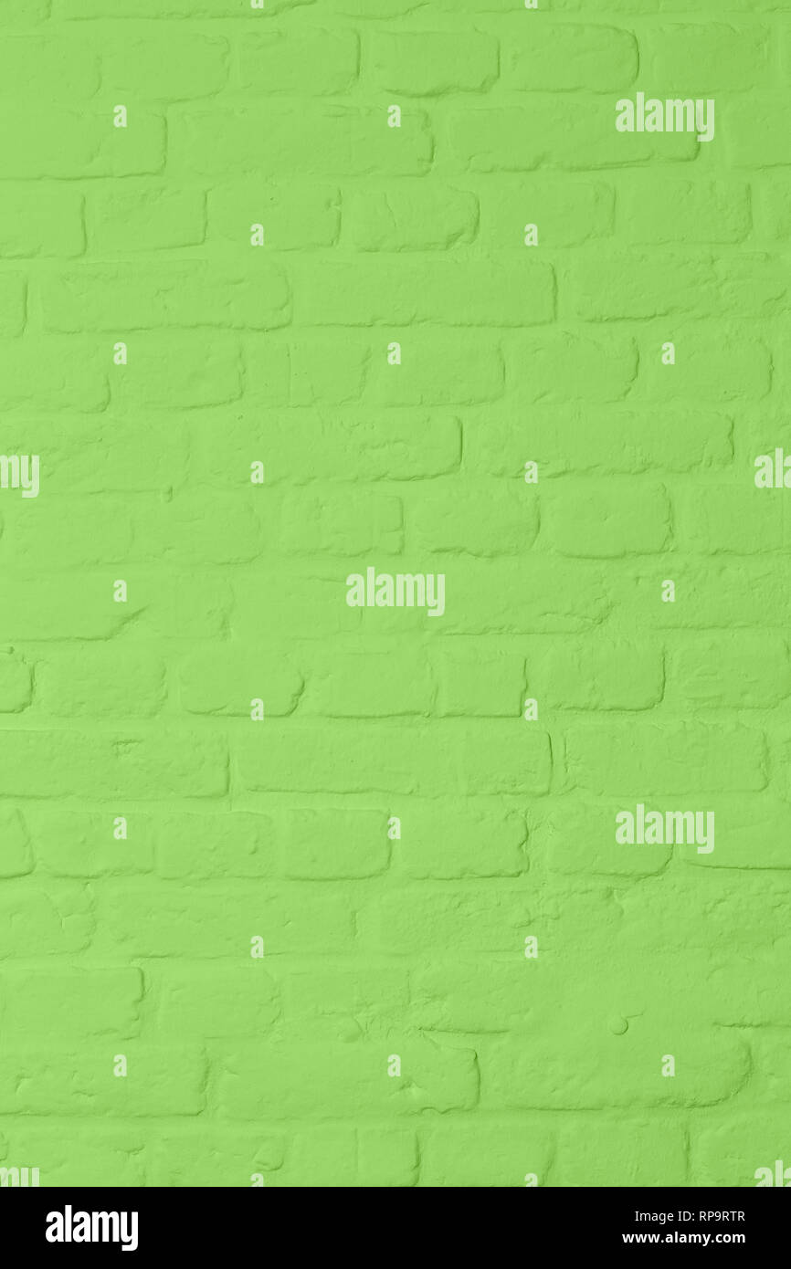 Pastell bright green colored brickstone wall, full frame, image background Stock Photo