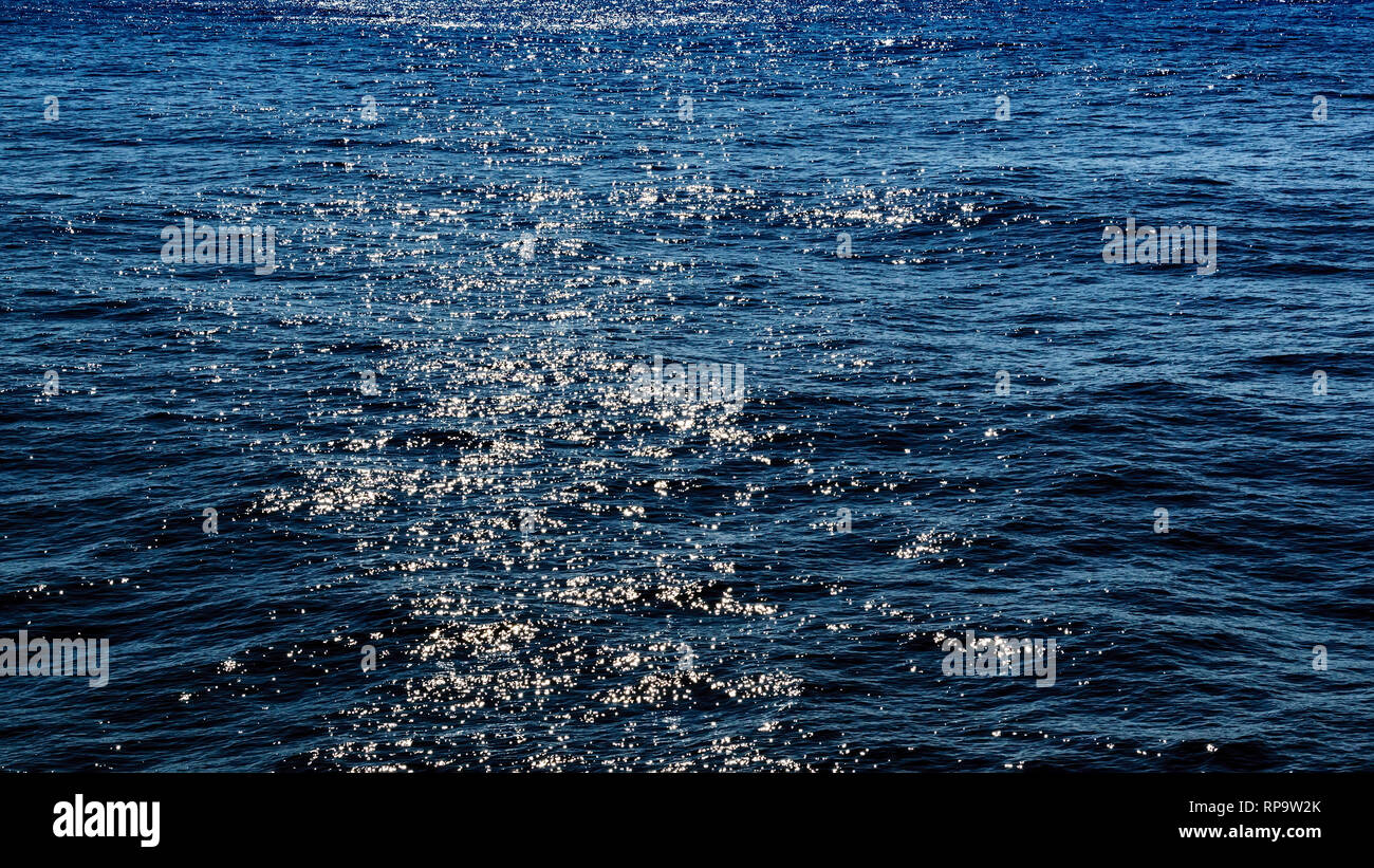 Seascape with water reflected sunlight Stock