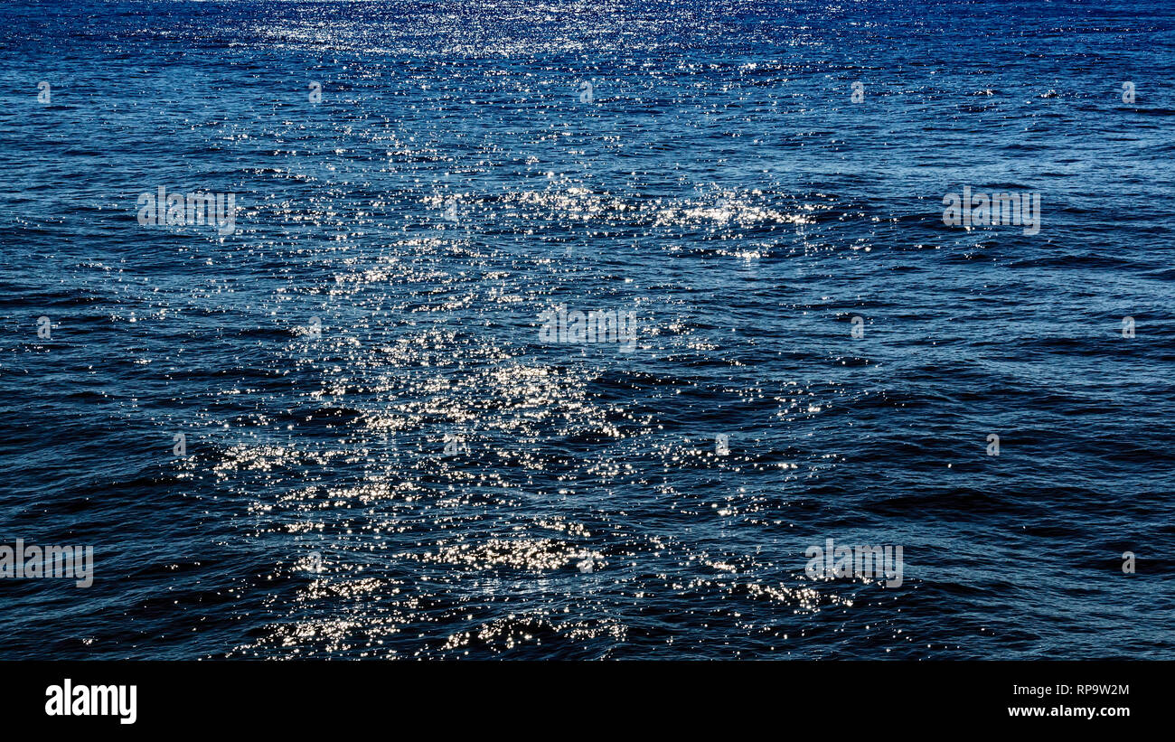 Seascape with water reflected sunlight Stock Photo - Alamy