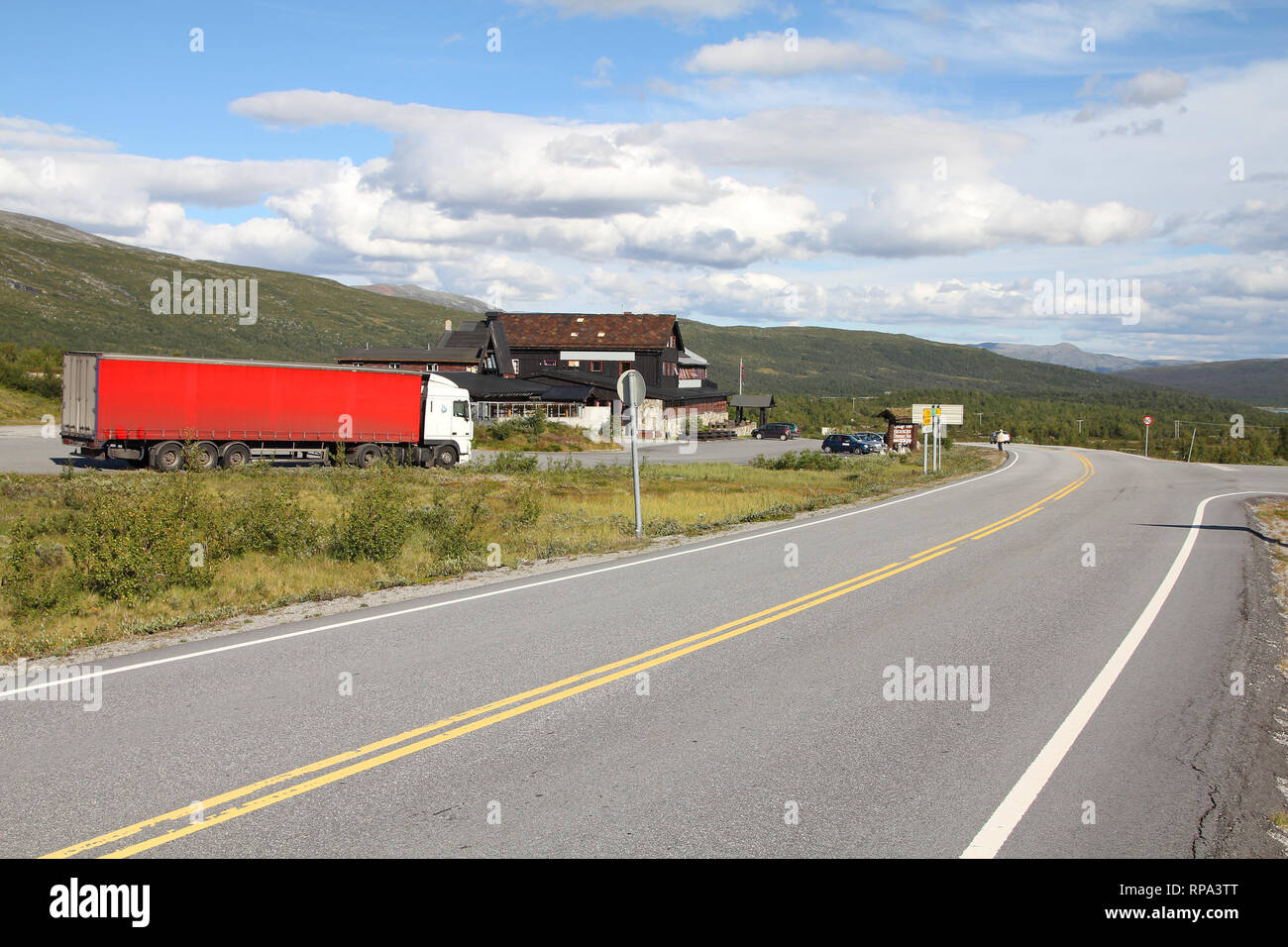 Mountain road in Norway, Oppland county. Roadside parking and motel in the middle of nowhere. Stock Photo