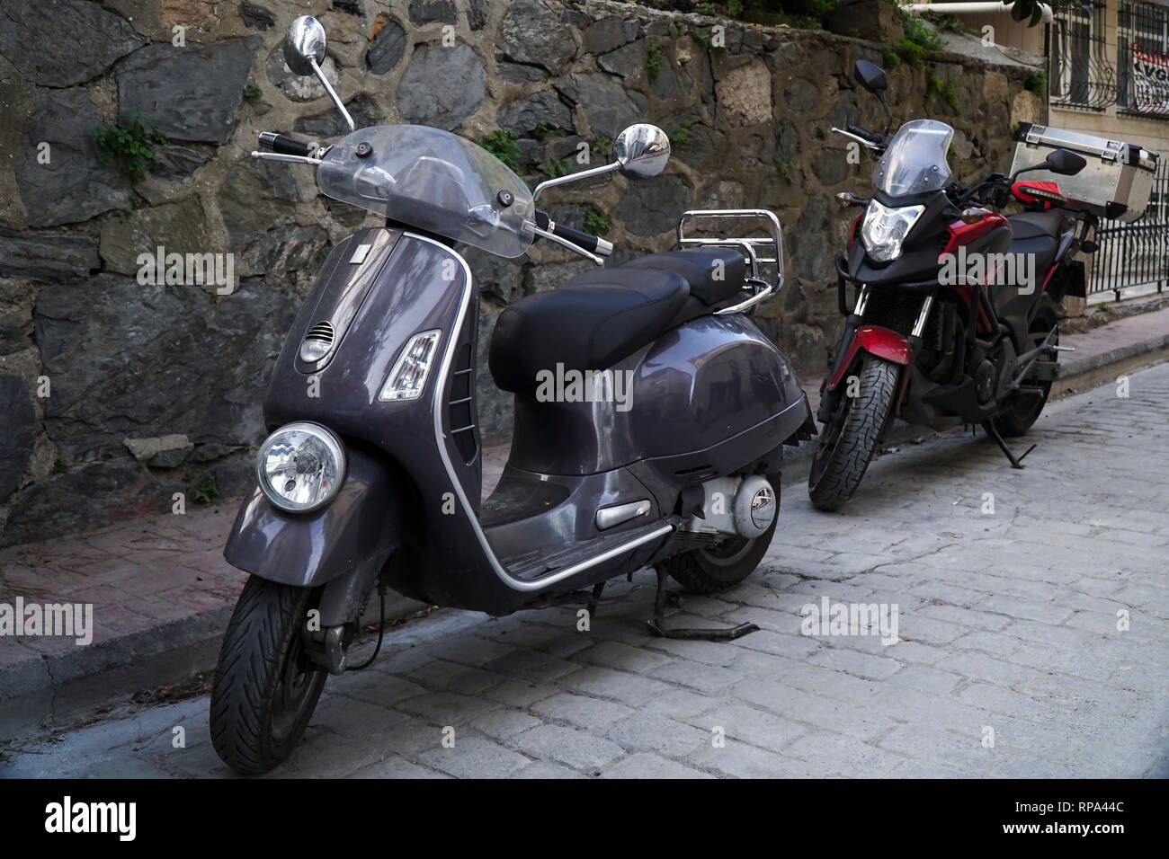 Istanbul Turkey August 18 2017 A Gray Vintage Vespa And A Red And Black Colored Honda Touring Motorcycle Are Parked At Street Stock Photo Alamy