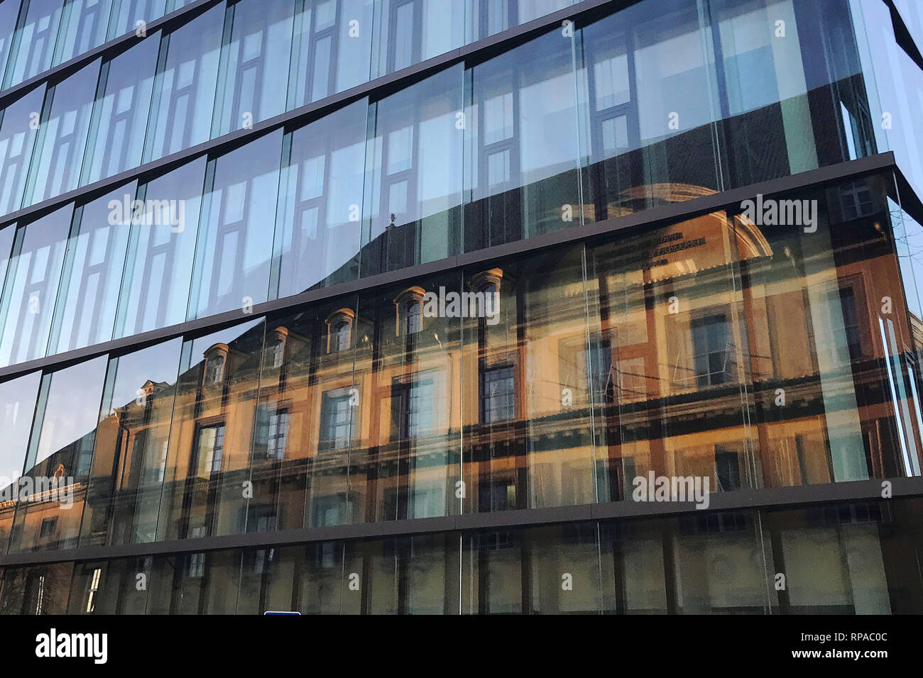 Munich, Deutschland. 15th Feb, 2019. City of Munich, old buildings, old apartments in Schwabing reflected in a modern glass office building, glass front, windows, immobility, metropolis, real estate prices, real estate, Stadtwithte, center, facades, facade, building, houses, location, interior, city location, downtown, city center, cityscape, | usage worldwide Credit: dpa/Alamy Live News Stock Photo
