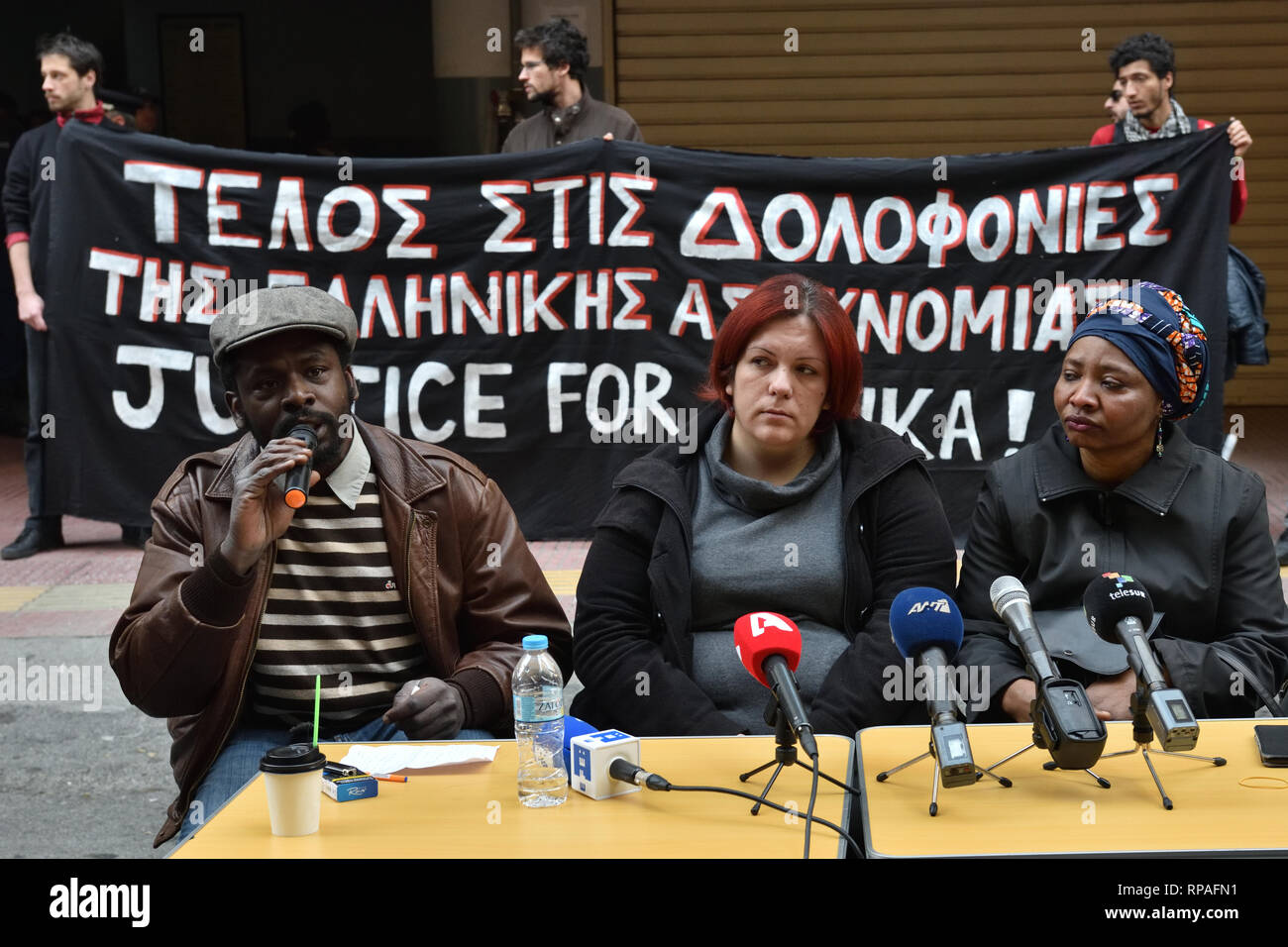 Athens, Greece. 21st Feb 2019. Protesters in front of the Omonia police station demand justice for Nigerian migrant Ebuka who died there under police custody  in Athens, Greece. Credit: Nicolas Koutsokostas/Alamy Live News. Stock Photo