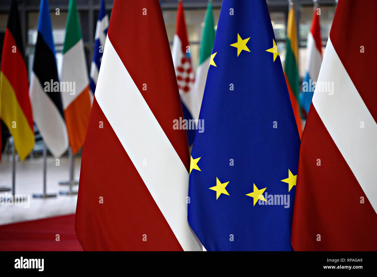 Brussels, Belgium. 21st February 2019. Flags of Latvia and EU flags stand in the European Council . Alexandros Michailidis/Alamy Live News Stock Photo