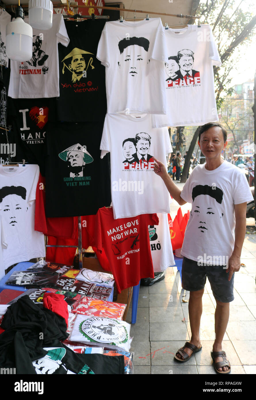 Hanoi, Vietnam. 21st Feb, 2019. Truong Thanh Duc, t-shirt designer and shop owner, shows customers t-shirts showing the portraits of US President Trump and North Korean ruler Kim above the 'Peace' lettering. (to dpa 'Kegelhut-Trump and 'Peace' with Kim: T-Shirts are in Hanoi the racer' Credit: Bac Pham/dpa/Alamy Live News Stock Photo