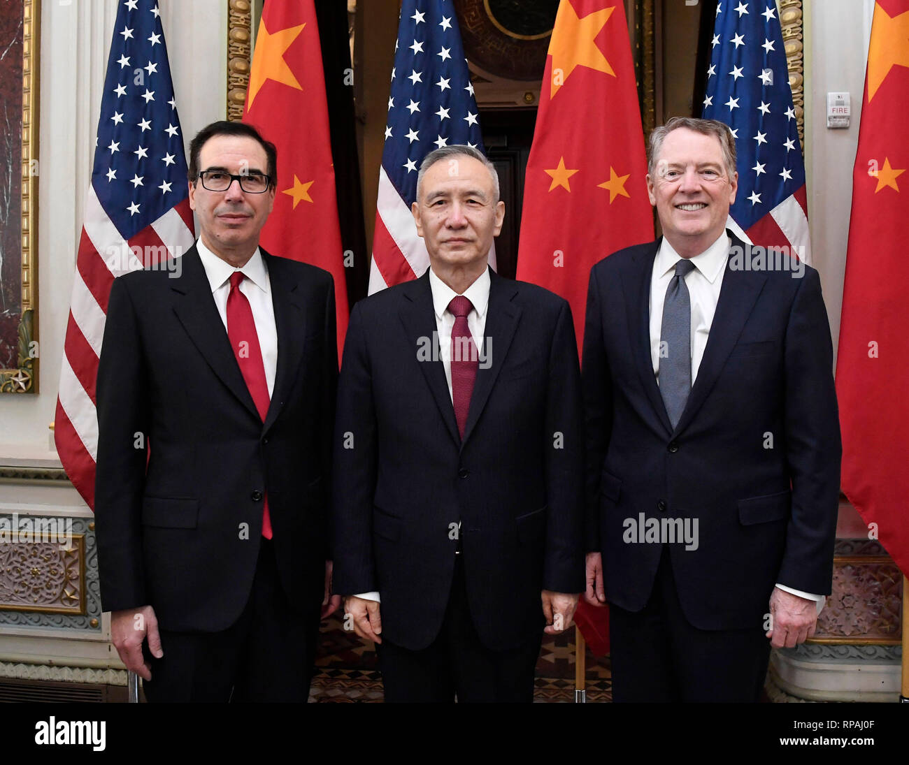 Washington, USA. 21st Feb, 2019. Chinese Vice Premier Liu He (C), who also comes as the special envoy of Chinese President Xi Jinping, U.S. Trade Representative Robert Lighthizer (R) and Treasury Secretary Steven Mnuchin co-chair the formal opening of a fresh round of high-level economic and trade talks at the Eisenhower Executive Office Building of the White House in Washington, DC, the United States, on Feb. 21, 2019. China and the United States on Thursday morning kicked off here a fresh round of high-level economic and trade talks. Credit: Liu Jie/Xinhua/Alamy Live News Stock Photo