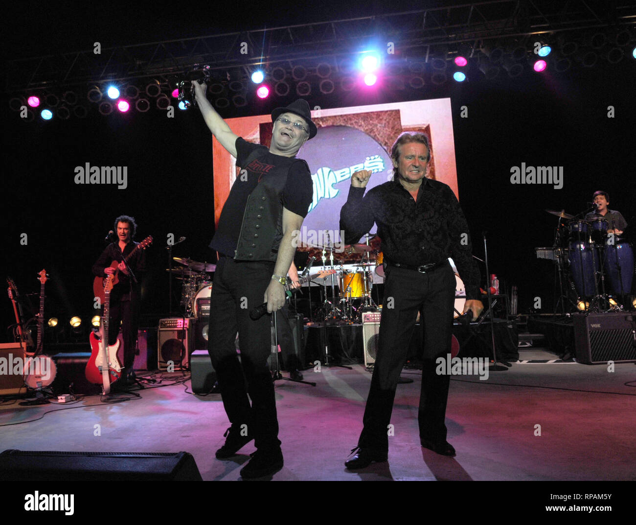 POMPANO BEACH, FL - JUNE 05:  Davy Jones, Peter Tork and Micky Dolenz of The Monkees perform their U.S. Tour at t the Pompano Beach Ampitheatrer.  on June 5, 2011 in Pompano Beach, Florida.  People:   The Monkees Stock Photo
