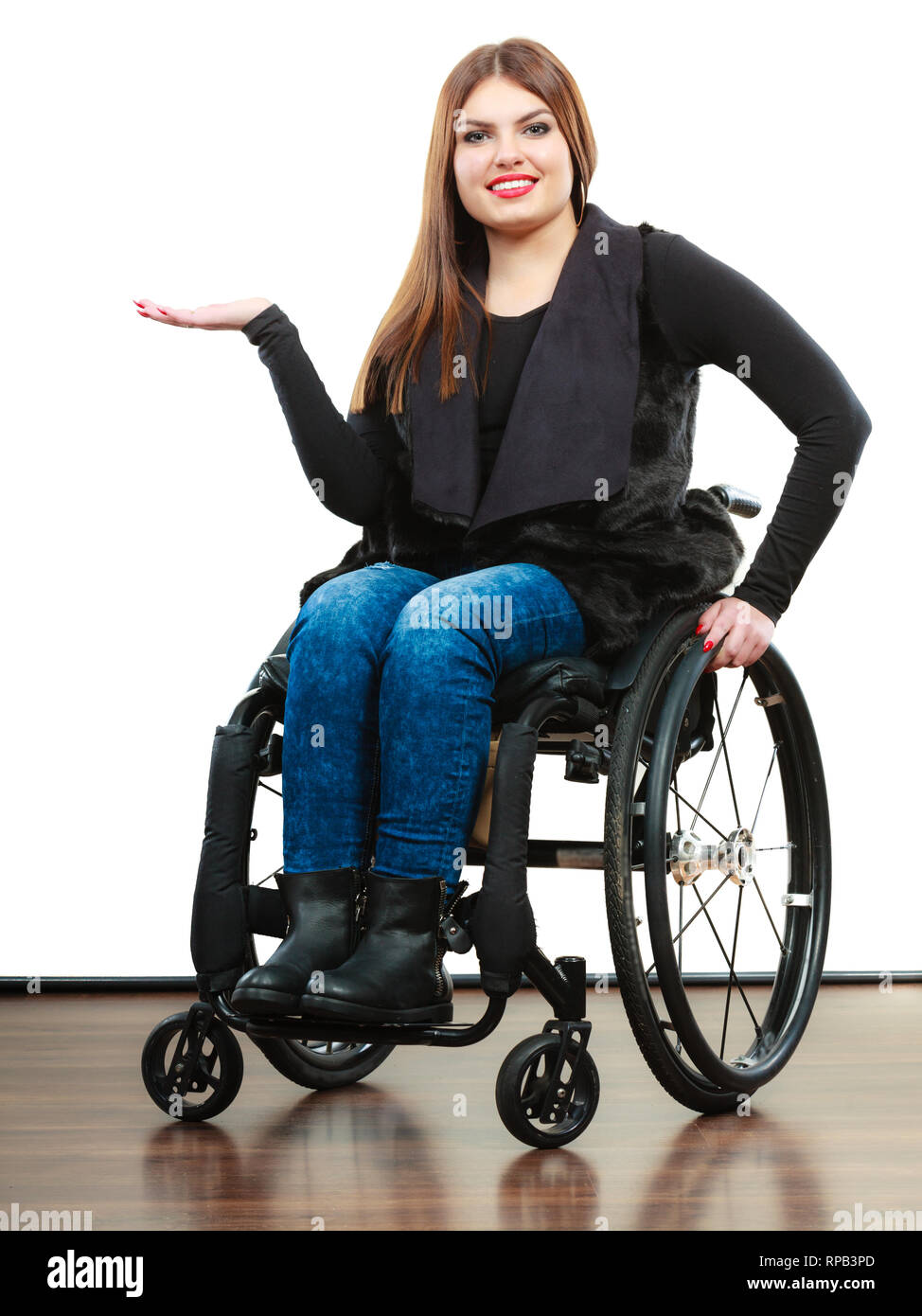 Real people, disability and handicap concept. Teen girl unrecognizable  person sitting on wheelchair holds open hand for product studio shot on  white Stock Photo - Alamy