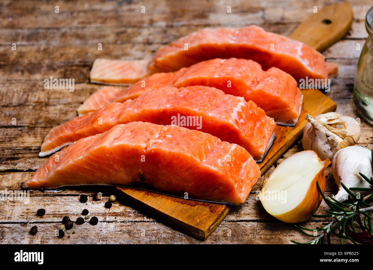 Salmon fish meat with cooking ingredients on a cutting board Stock ...