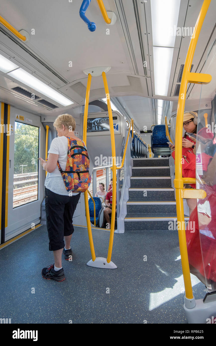 The interior vestibule or entrance area of a modern Waratah A Series train travelling on Sydney's North Shore T1 Line in New South Wales, Australia Stock Photo