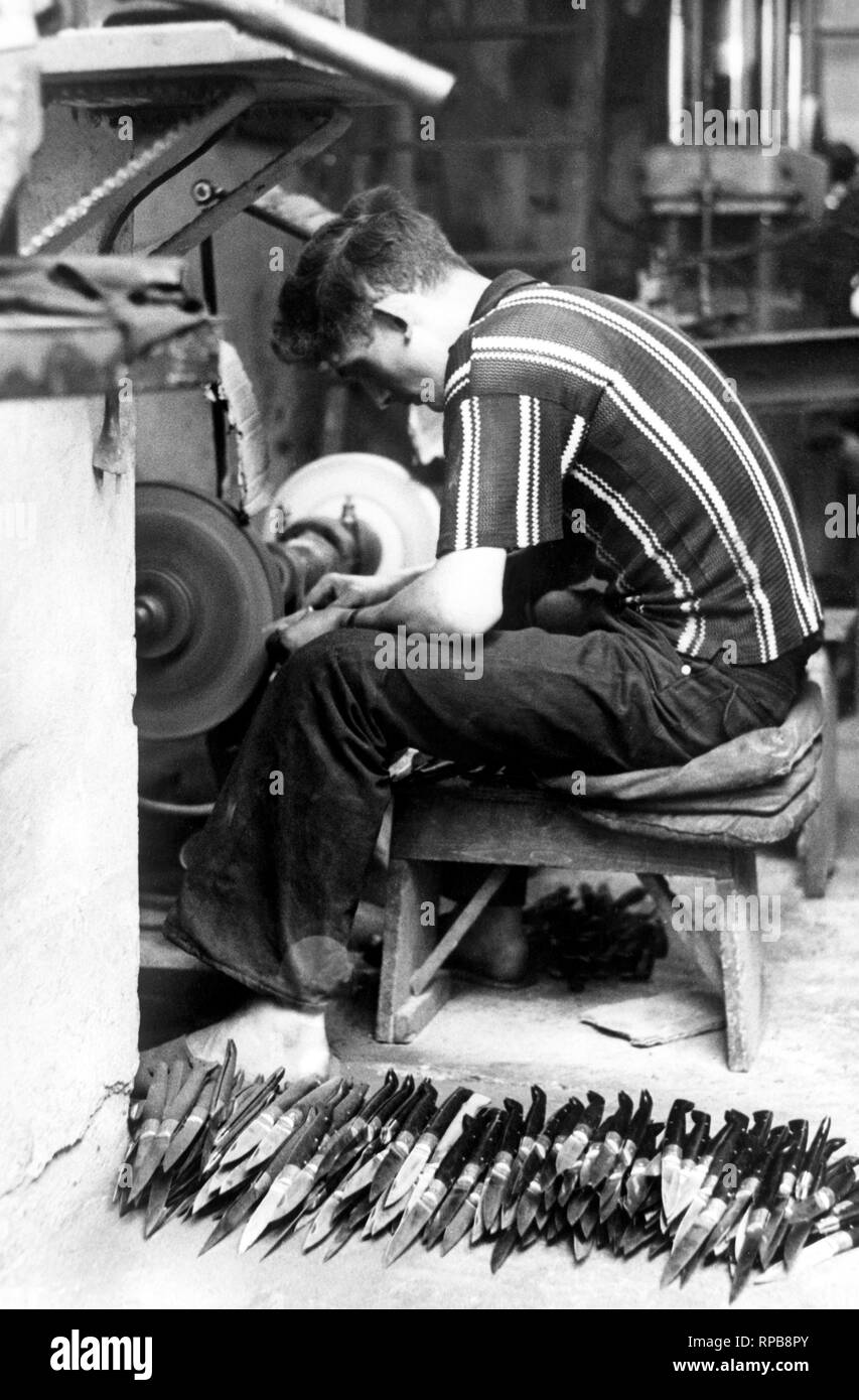 worker manufacturing pattads, typical sardinian knives, italy 1964