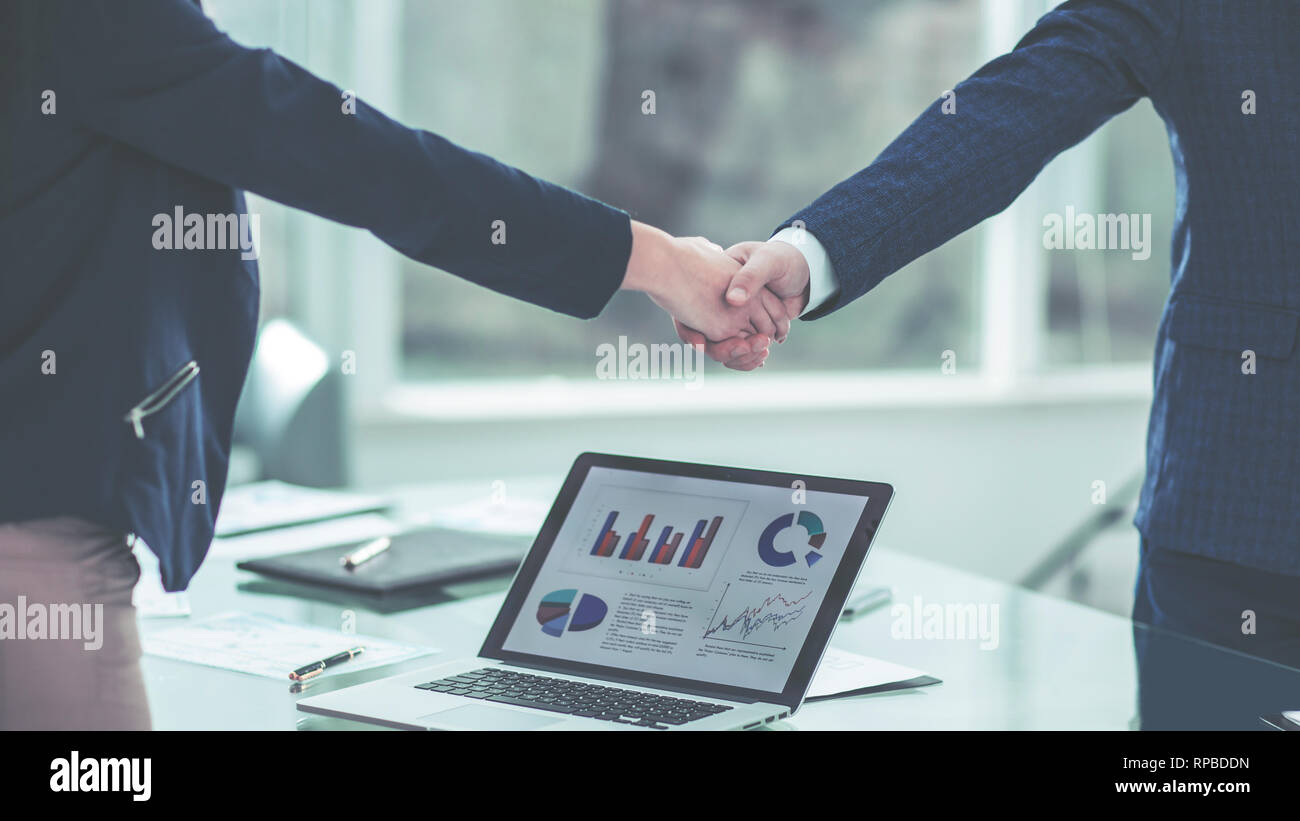 shaking-hands-with-financial-partners-ne