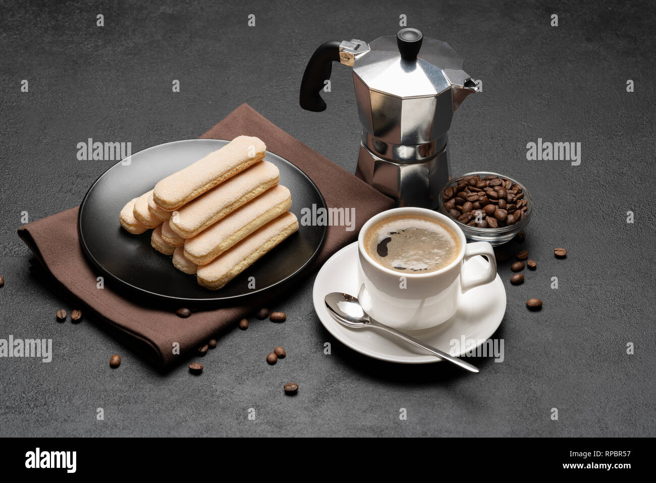 Italian Savoiardi ladyfingers Biscuits and cup of coffee on concrete ...
