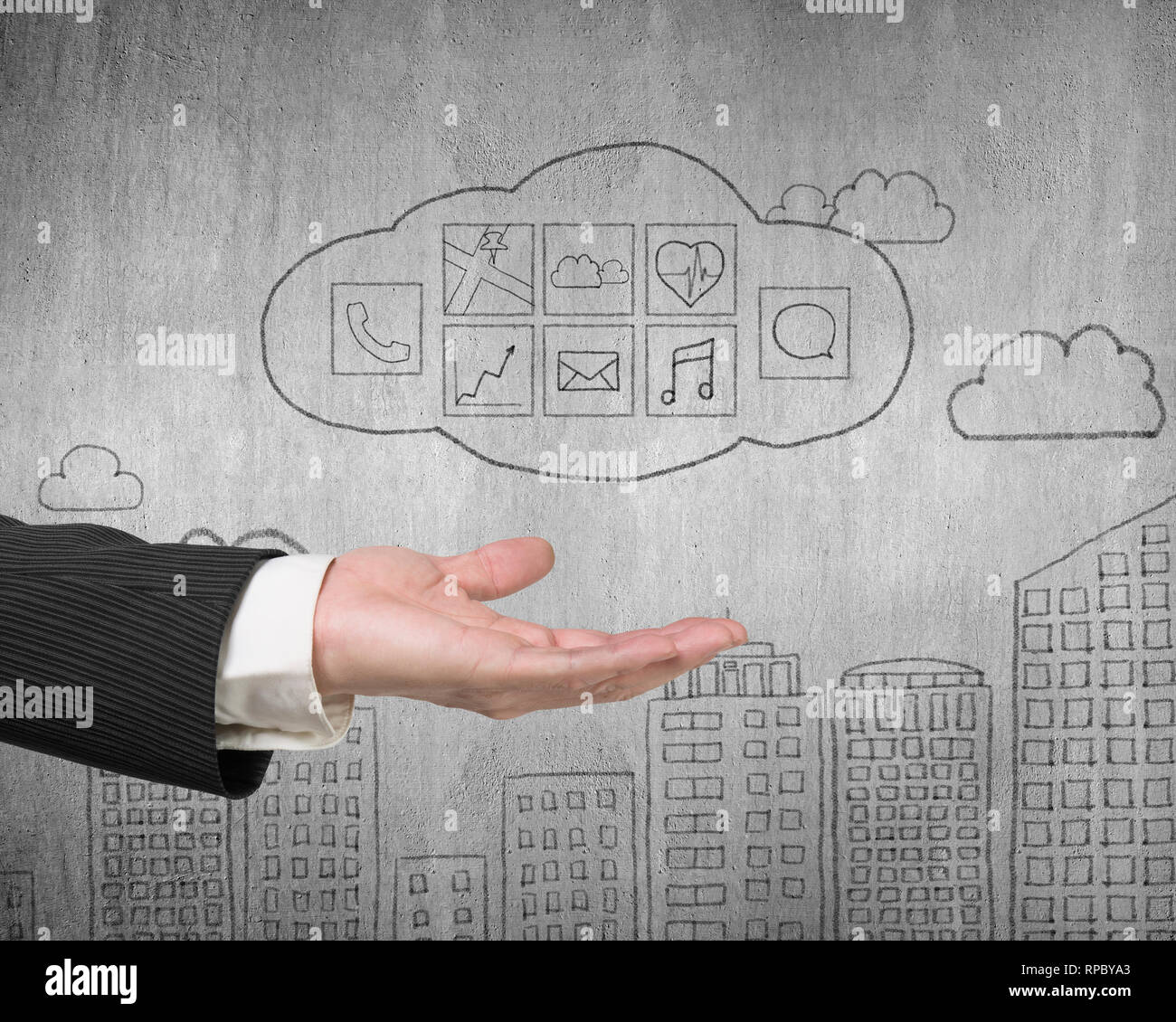 Male hand showing cloud with app icons doodles on concrete wall background Stock Photo