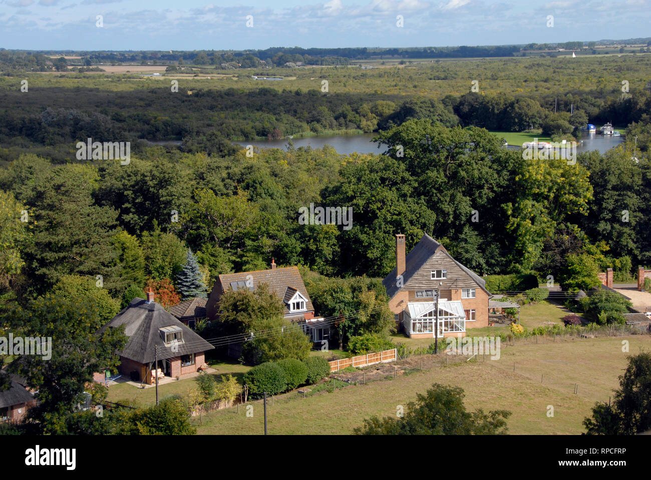 View from the top of the tower of St Helen's church, Ranworth, Norfolk, over homes and part of the Norfolk Broads. Stock Photo