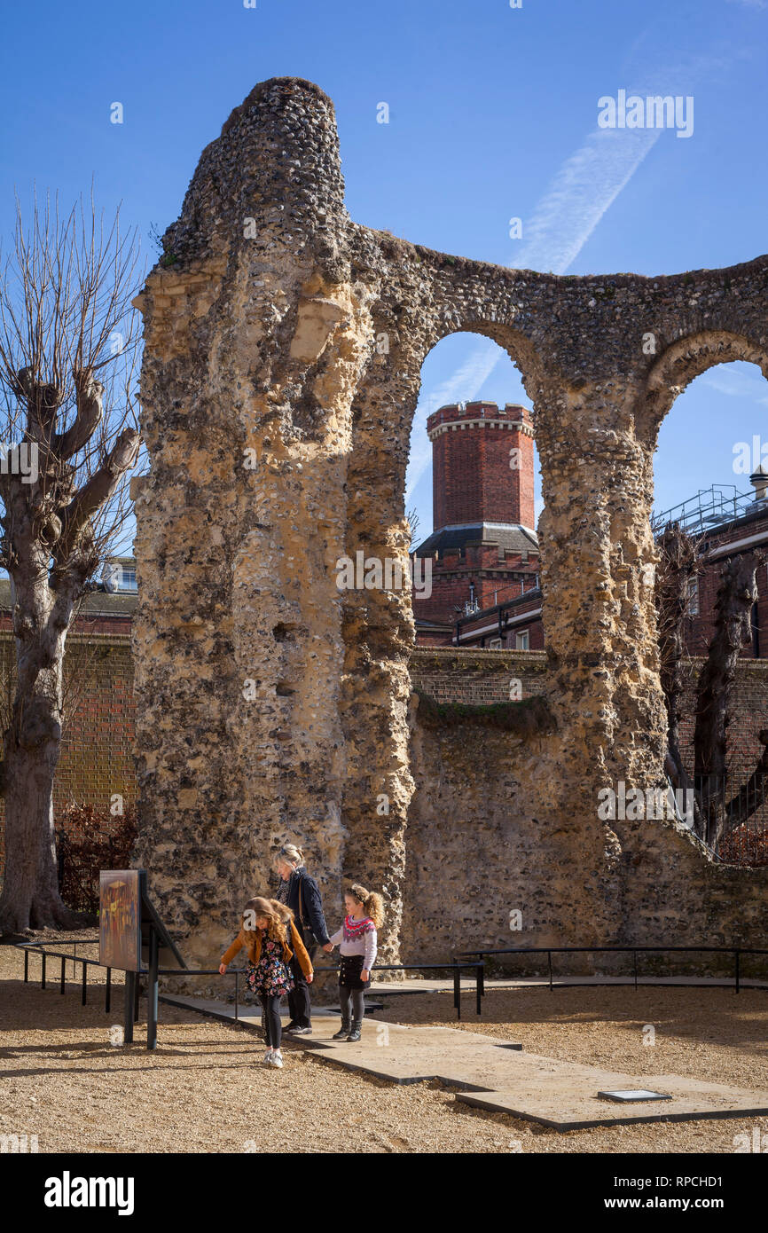 A mother and her two children visit the ruins of Reading Abbey with