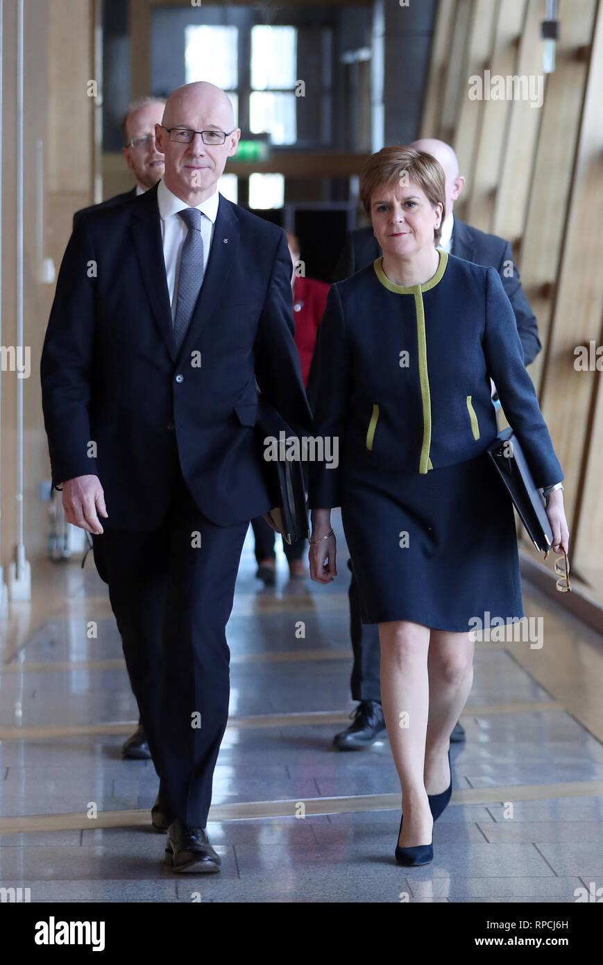 First Minister Nicola Sturgeon and Deputy First Minister John Swinney (left) arrive ahead of First Minister's Questions at the Scottish Parliament in Edinburgh. Stock Photo