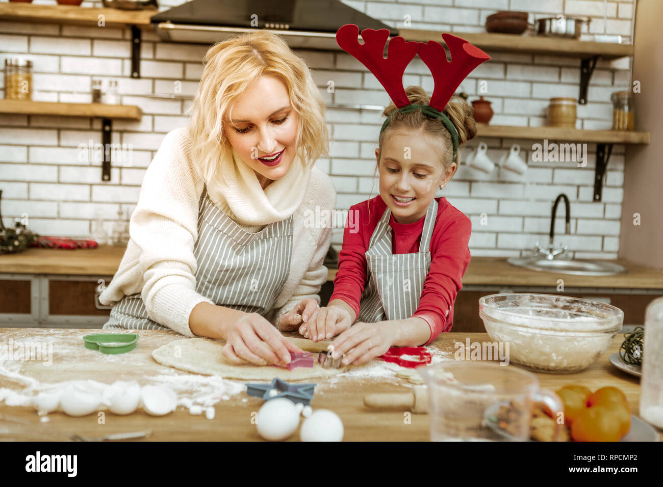 Blonde woman being happy with time spending with her daughter Stock Photo