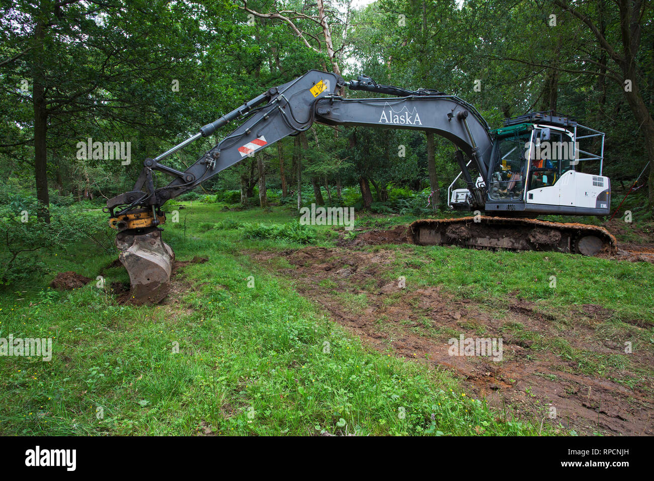 Digger involved in stream restoration work Wootton New Forest National