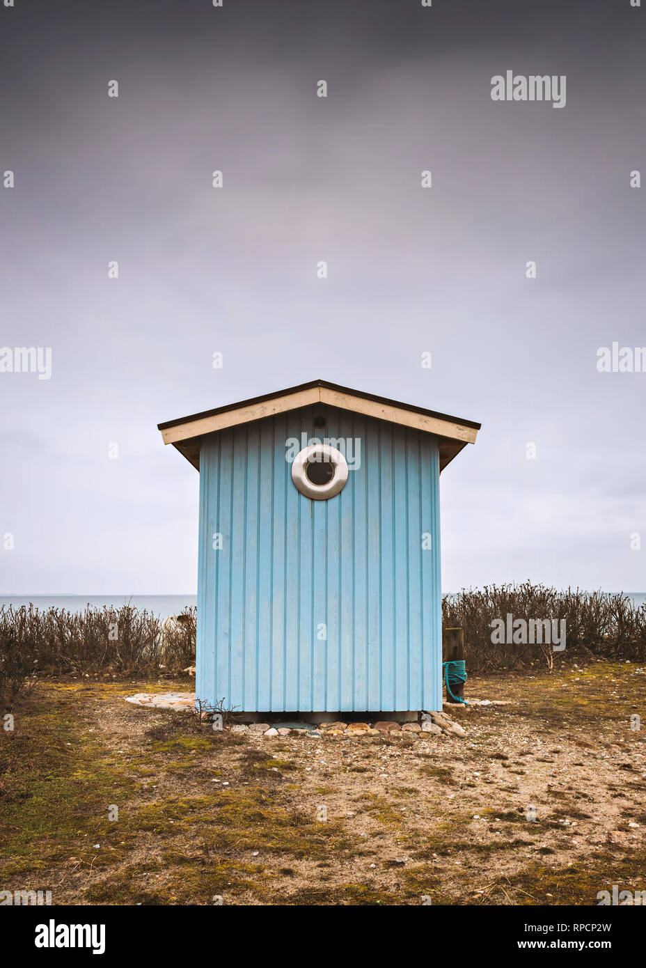 Blue wooden beach hut. Viken, Sweden. Stock Photo