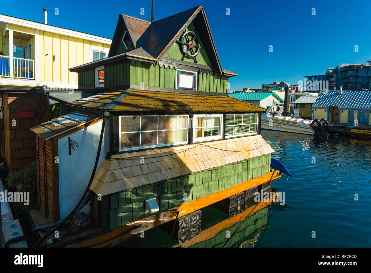 VICTORIA BC CANADA FEB 12, 2019: Victoria Inner Harbour, Fisherman Wharf is a hidden treasure area. With colorful floating homes, gifts, food and wild Stock Photo