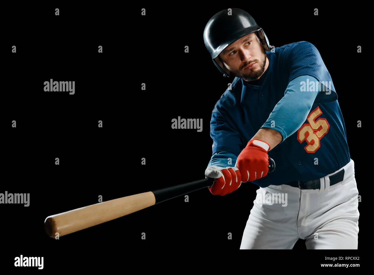 Baseball player swinging a bat Stock Photo Alamy