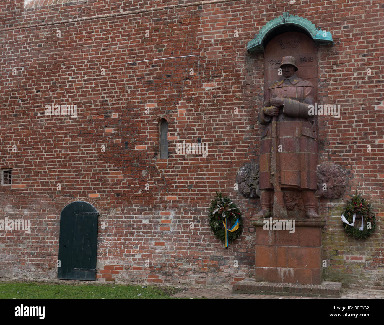 Statue of German soldier, commemorating First World War dead. Norden. East Frisia. Lower Saxony. Germany. Stock Photo