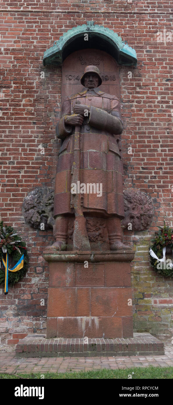 Statue of German soldier, commemorating First World War dead. Norden. East Frisia. Lower Saxony. Germany. Stock Photo
