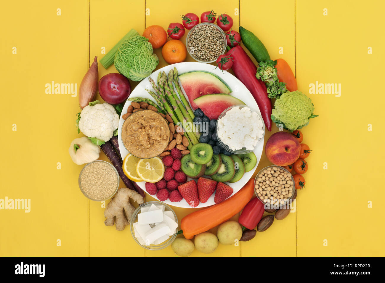 Vegan health food with fresh fruit, vegetables, peanut butter, tofu