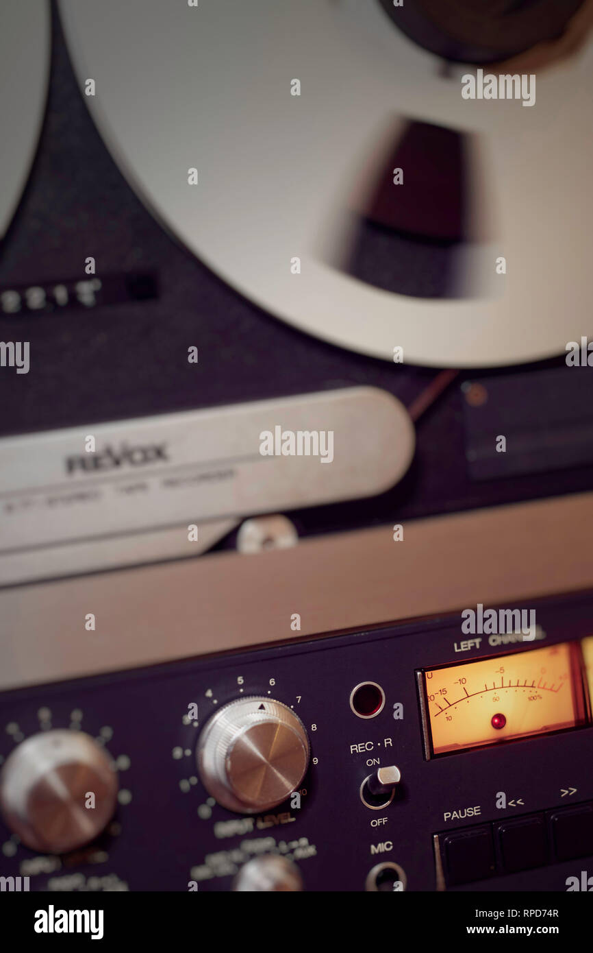 Spinning tape spool with 'record' emphasis on a Revox B77 reel to reel ...