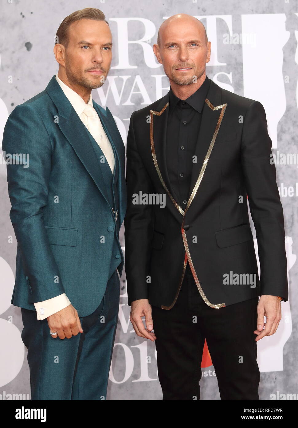Matt and Luke Goss - Bros are seen on the red carpet during The BRIT Awards 2019 at The O2, Peninsula Square in London. Stock Photo