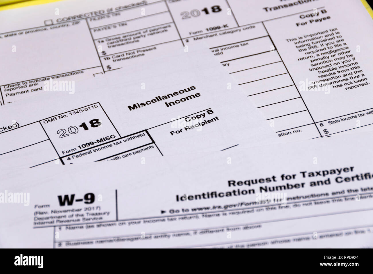 Composed shot of IRS tax forms 1099-MISC, 1099-K and W-9 Stock Photo