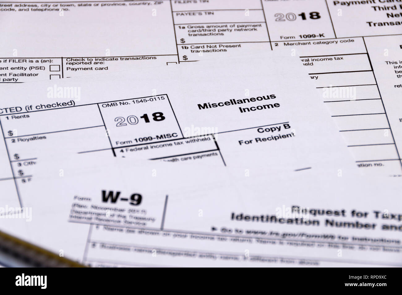 Composed shot of IRS tax forms 1099-MISC, 1099-K and W-9 Stock Photo