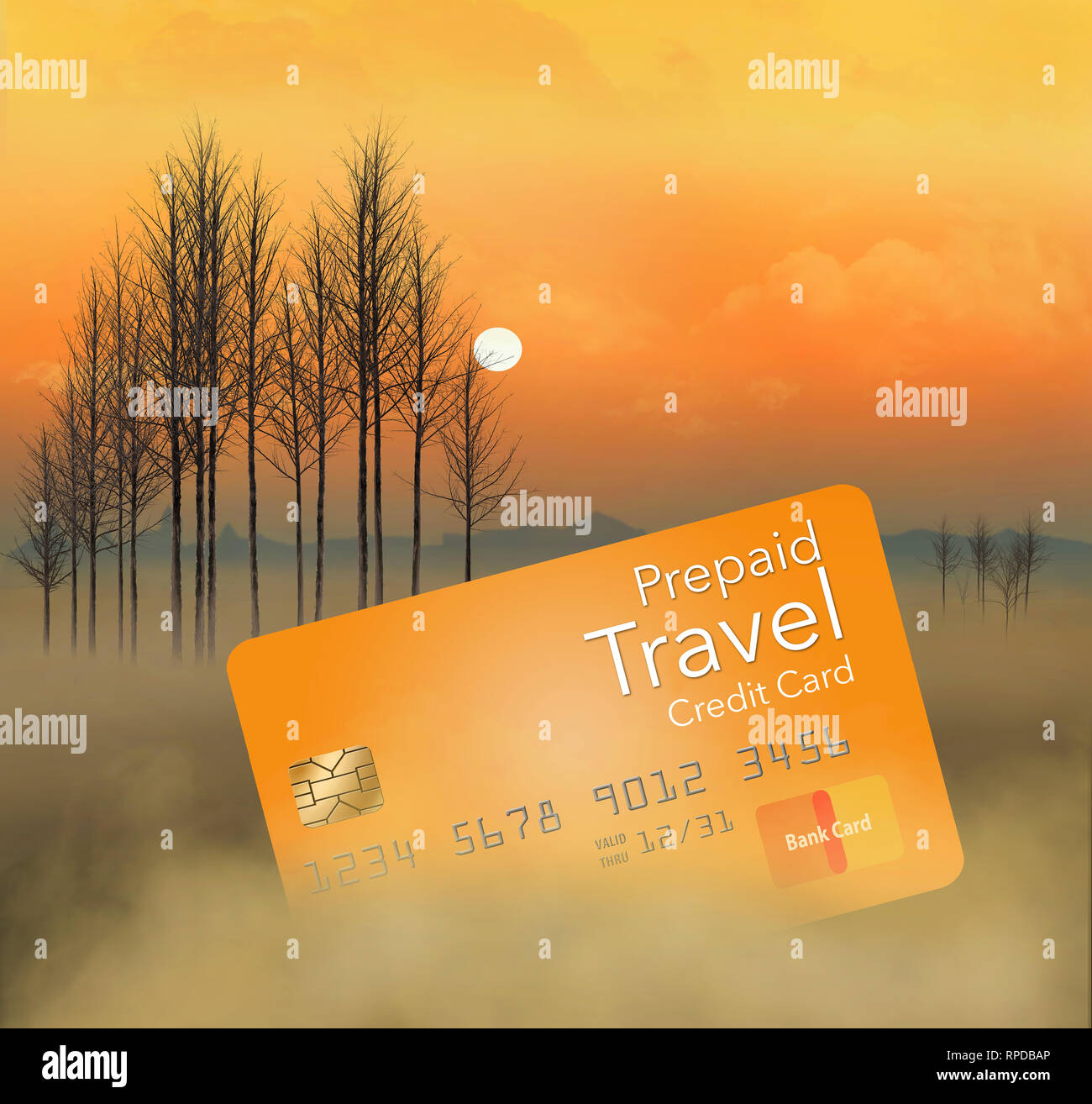 A prepaid travel credit card is seen in a meadow at sunrise with trees, fog, sky and clouds. This is an illustration Stock Photo