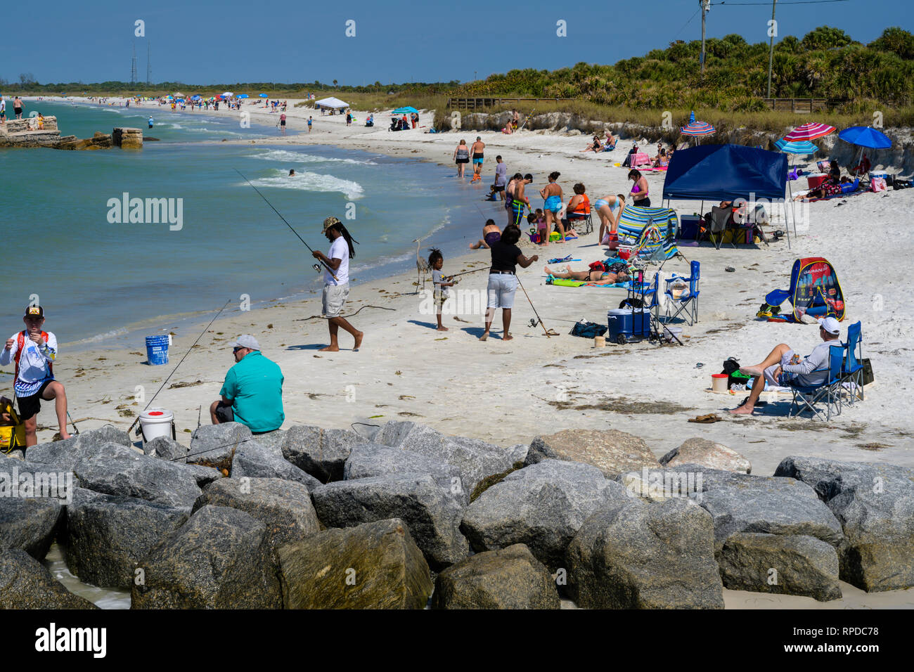 Fort De Soto Park, Florida -- February 17, 2019.  A diverse crowd of fishermen, swimmers and sunbathers take to the beach. Stock Photo
