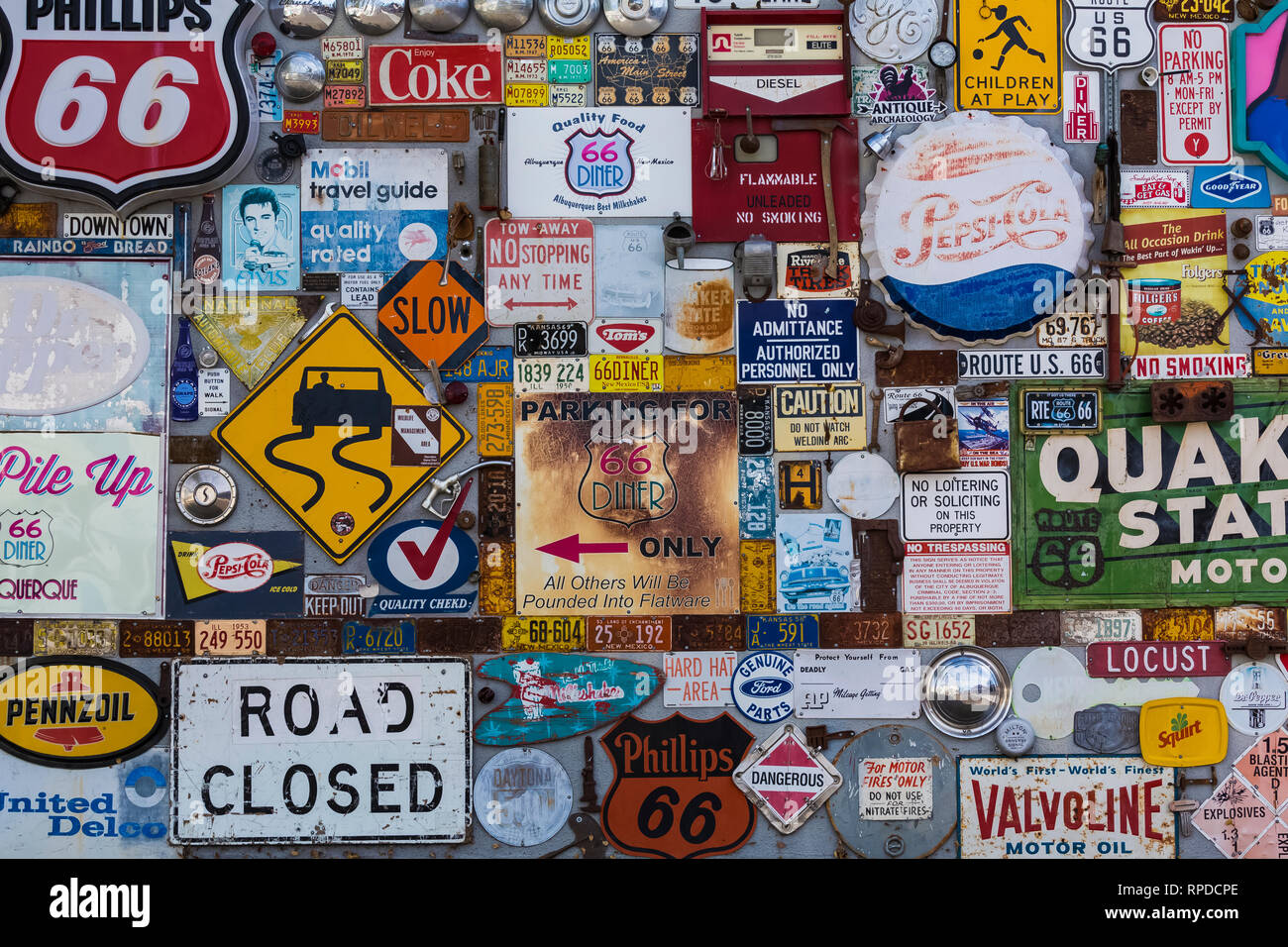 Collection of antique highway and commercial signs behind 66 Diner, a nostaligic restaurant along Historic Route 66 in Albuquerque, New Mexico, USA [N Stock Photo