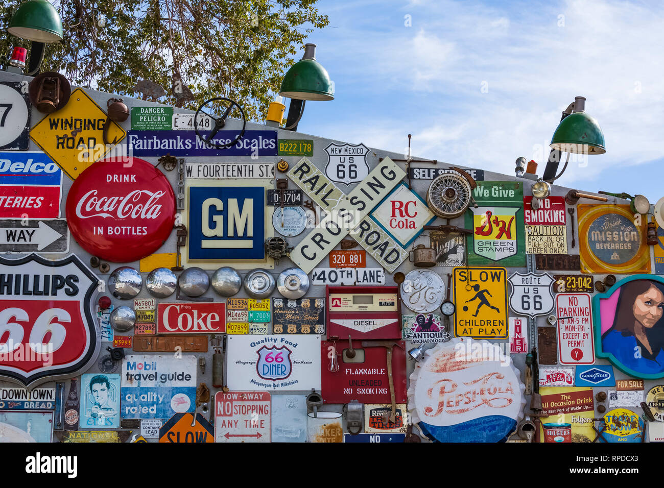 Collection of antique highway and commercial signs behind 66 Diner, a nostalgic restaurant along Historic Route 66 in Albuquerque, New Mexico, USA [No Stock Photo