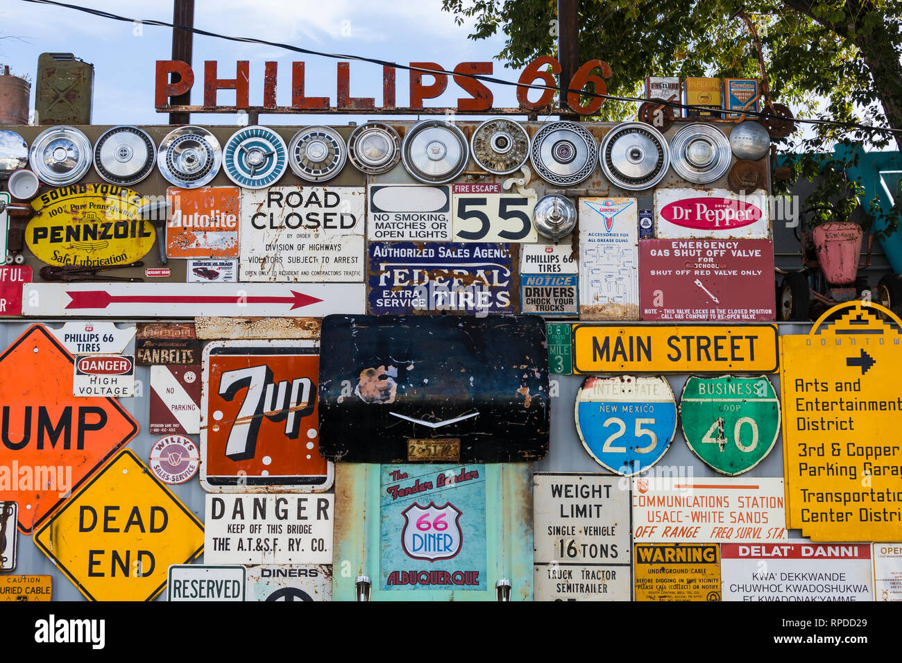 Collection of antique highway and commercial signs behind 66 Diner, a nostalgic restaurant along Historic Route 66 in Albuquerque, New Mexico, USA [No Stock Photo