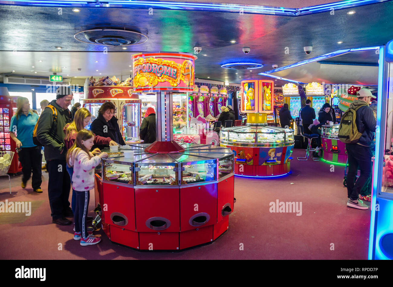 A view inside an amusement arcade in Bournemouth, Dorset where holidaymakers are having fun playing on the machines. Stock Photo