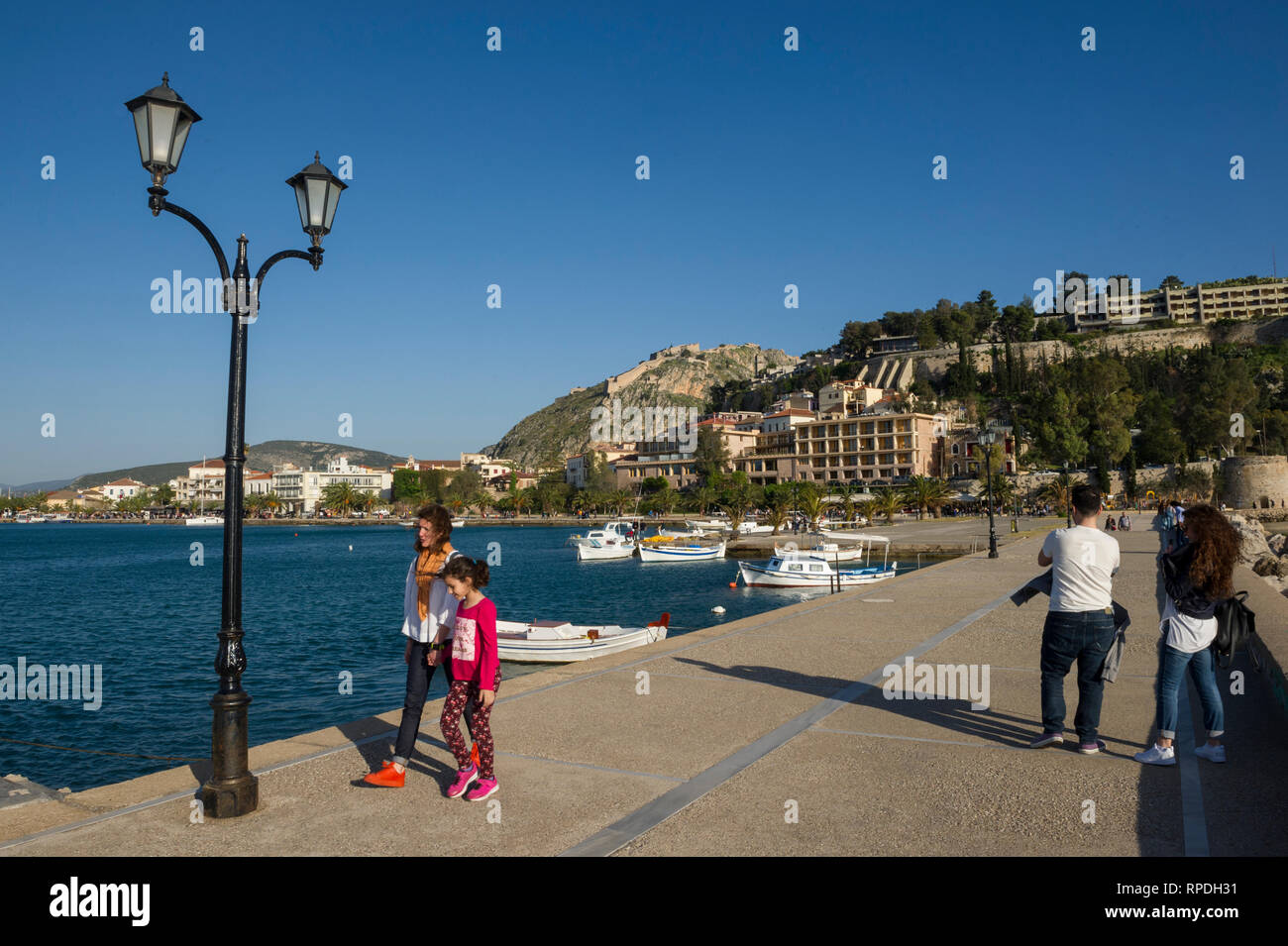 Waterfront and Palamidi Castle on the hill, Nafplio, Greece Stock Photo ...