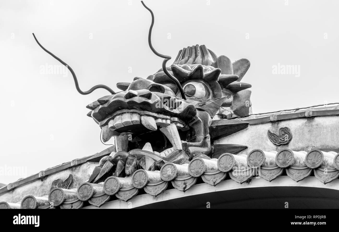 Okinawa, Shuri Castle (首里城). Detail of Seiden (正殿), front roof Dragon. UNESCO World Heritage Site Stock Photo