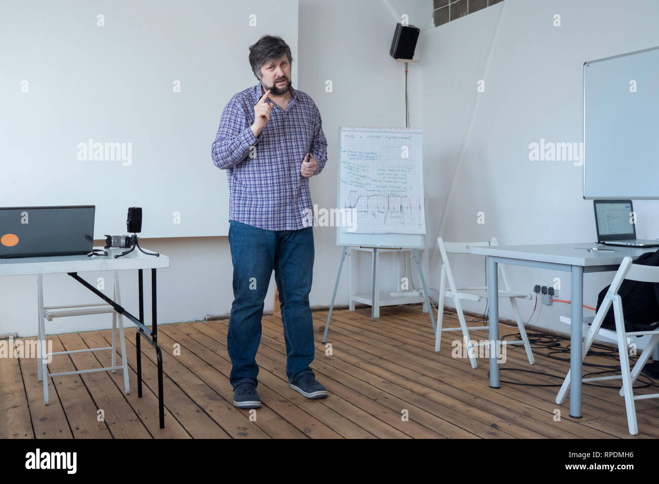 Programmer, architect sharing his experience. Political technologist giving advices. Experienced worker consulting new specialists. Creative person Stock Photo